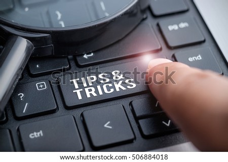 Finger on laptop keyboard written Tips & Tricks