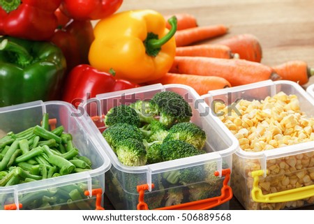 Trays with raw vegetables for freezing. Stocking up for winter storage in plastic containers Royalty-Free Stock Photo #506889568