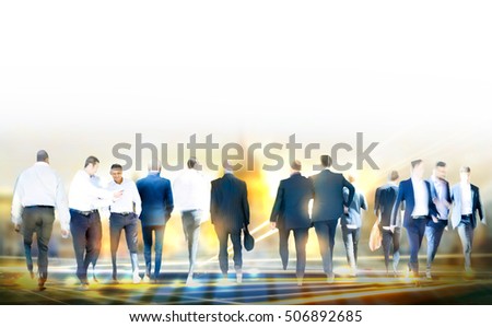 Business people walking in the City, blurred image with lights reflection. Business and modern life concept