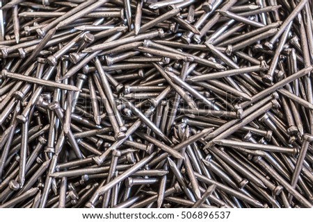 Close-up of a pile of iron nails. Steel nails, iron nails, workshop,background pattern