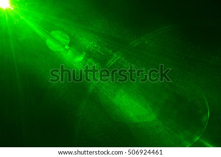 Camera lens flare by laser light create hexagons of objective iris shapes of number depending on number of lens surface and interferent effect and moire on digital sensor on dark black background