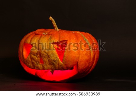 jack o lantern big orange pumpkin on a black background