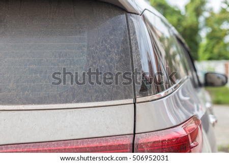 Close up backside of dirty car. Car wash concept