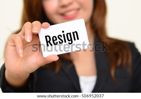 woman hold card  have "resign" word