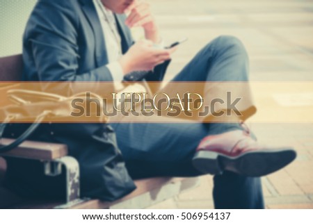 Hand writing UPLOAD  with the abstract background. The word UPLOAD represent the meaning of word as concept in stock photo.