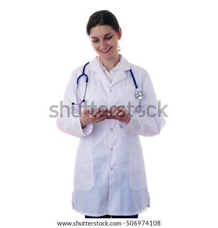 Smiling female doctor in white coat over white isolated background with stethoscope and smart phone tablet, healthcare, profession and medicine concept
