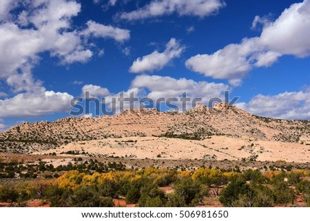 fall colors on a sunny day  along the butler wash road near comb ridge, near blanding, utah Royalty-Free Stock Photo #506981650