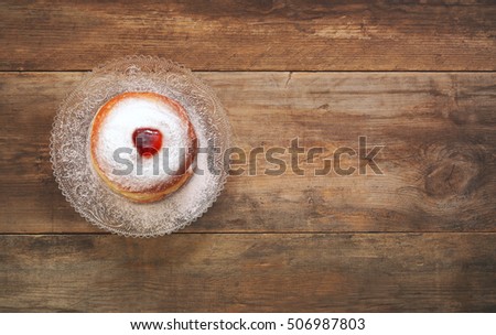 Top view image of jewish holiday Hanukkah with donut