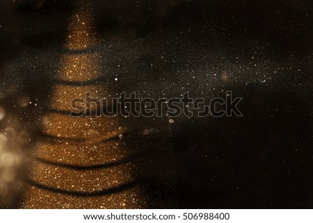 Defocused abstract gold and black lights background