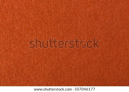 Background with orange felt texture. High resolution photo.