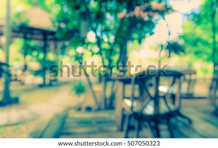 image of Abstract blurred outdoor coffee hut on day time in garden for background usage . (vintage tone)