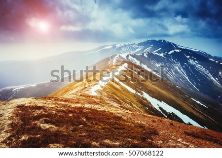 Great view of the snow range which glowing by sunlight. Dramatic and picturesque scene. Location place Carpathian, Ukraine, Europe. Beauty world. Retro and vintage style. Instagram toning effect.