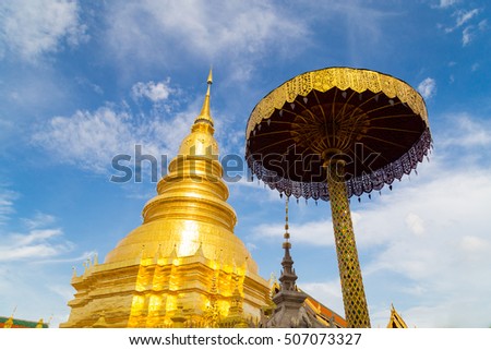 Golden pagoda and golden Buddha in Thailand public temple that anybody can came in and take a photo, Phrathat Haripunchai, Lamphun.