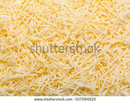 Heap of Grated pizza cheese close up texture Royalty-Free Stock Photo #507084820