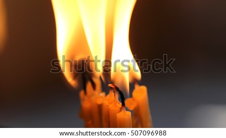  flame of a  church candles,  close up