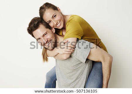 Fun couple smiling at camera, portrait