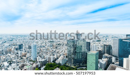 Asian Business concept for real estate and corporate construction - panoramic modern cityscape building bird eye aerial view under sunrise and morning blue bright sky in Tokyo, Japan