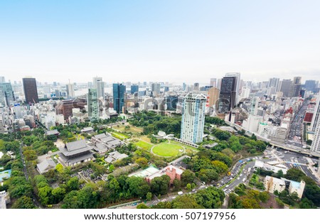 Business and culture concept - panoramic modern city skyline bird eye aerial view with zojo-ji temple shrine from tokyo tower under dramatic sunrise and morning blue sky in Tokyo, Japan