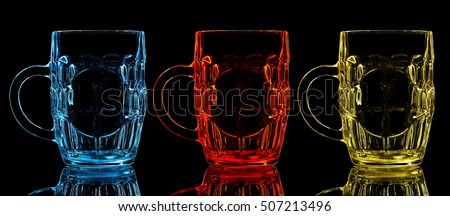 Silhouette of color beer glass on a black background