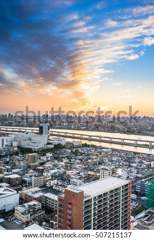 Asian Business concept for real estate and corporate construction - panoramic modern cityscape building bird eye aerial view with Mount Fuji under sunrise and morning blue bright sky in Tokyo,Japan