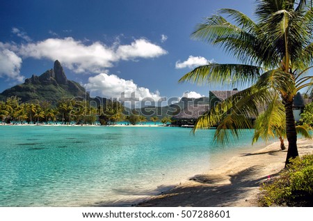 Turquoise water at Bora Bora island beach in the South Pacific ocean Royalty-Free Stock Photo #507288601