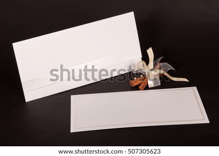 wedding invitations on black background