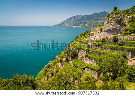 Panoramic picture-postcard view of famous Amalfi Coast with vineyards and Gulf of Salerno on a sunny day with blue sky in summer, Campania, Italy