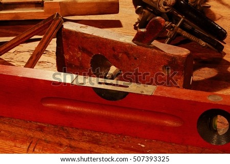 vintage wooden levels and carpenter tools