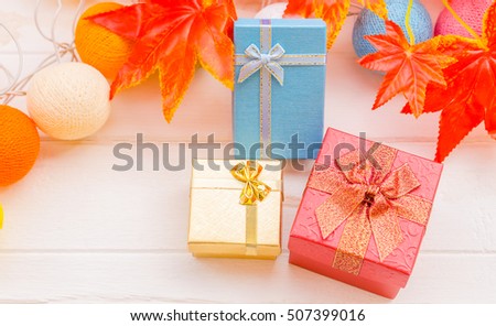 Colorful gift box on white table for Christmas and New Year 2017