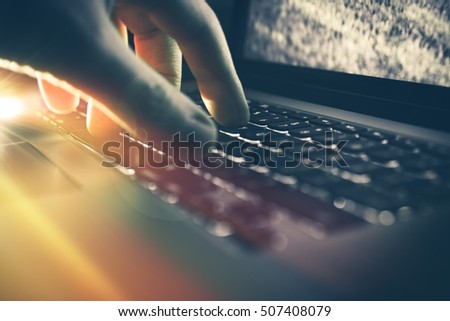 Men Working on His Laptop Computer Closeup Photo. Online Internet Work Concept