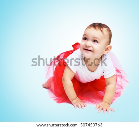 portrait of a cute baby, isolated against blue background