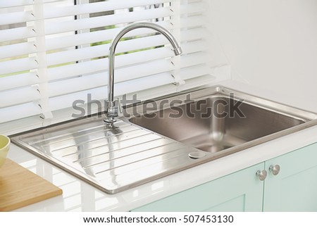 Modern kitchen sink, green tone Royalty-Free Stock Photo #507453130