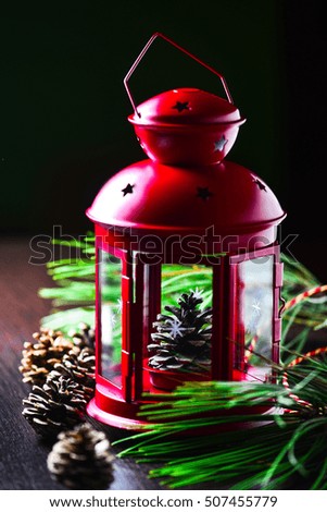 Christmas red lantern with a bump inside around green pine branches with cones, Notepad, on canvas, in muted colors with one light source