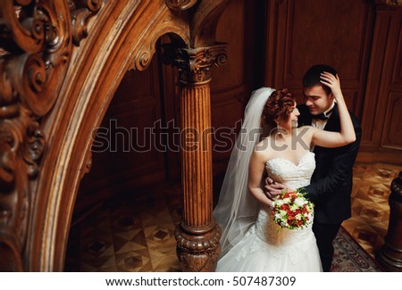 happy man embracing his wife's waist