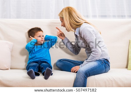 Angry mother is scolding at her son.Family conflict

 Royalty-Free Stock Photo #507497182