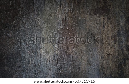 Grey stone background with an uneven texture.