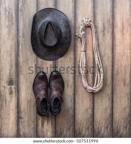 lariat, cowboy hat, leather boots