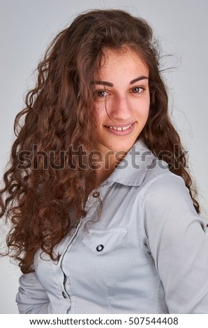 Young curly girl with brown eyes