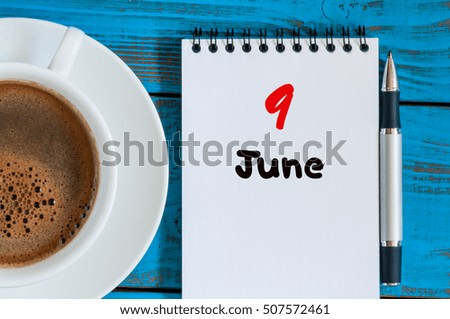 June 9th. Image of june 9 , calendar on blue background with morning coffee cup. Summer day, Top view