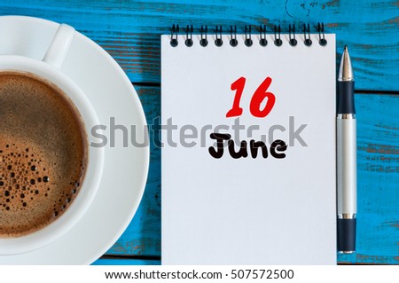 June 16th. Image of june 16 , calendar on blue background with morning coffee cup. Summer day, Top view