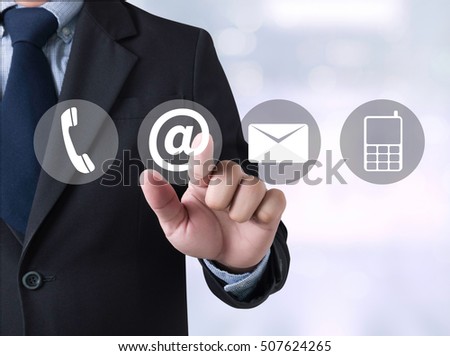 CONTACT US (Customer Support Hotline people CONNECT ) Businessman touching a touch screen on blurred city background