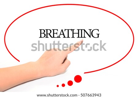 Hand writing BREATHING  with the abstract background. The word BREATHING represent the meaning of word as concept in stock photo.