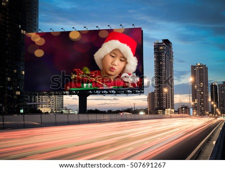 Christmas billboard on the road and space for your logo and message. Advertising concept