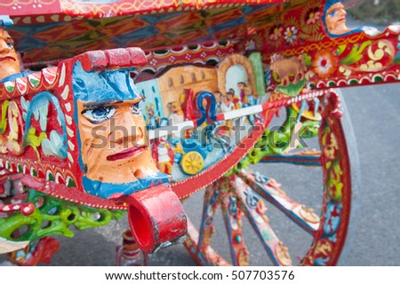 Closeup view of a colorful detail of a typical sicilian cart