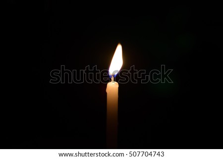 candle flame against black