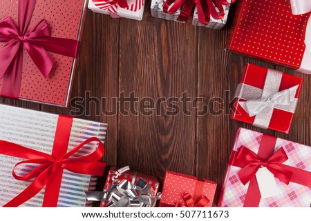 Gift boxes on wooden table. Top view with copy space