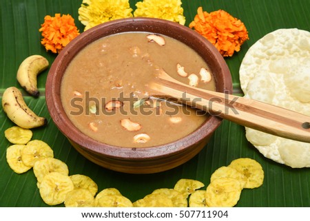 Traditional creamy dal/broken wheat  payasam/kheer/dessert Kerala, South India. Indian mithai served on festival, birthdays. Delicious Onam/vishu/Deepawali  sweet dish in clay pot on banana leaf.
