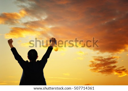 Win concept. Businessman holding gold medal. Royalty-Free Stock Photo #507714361