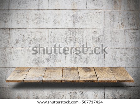 Empty top wooden shelves and stone brick wall background. For product display