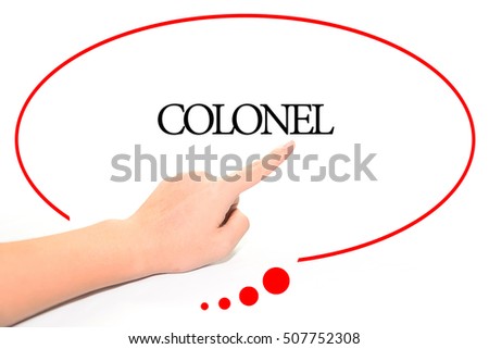 Hand writing COLONEL  with the abstract background. The word COLONEL represent the meaning of word as concept in stock photo.